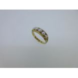 An 18ct gold pearl set ring,