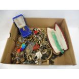 A box of assorted costume jewellery.