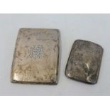 A silver cigarette case, Birmingham 1916, maker A&J Zimmerman and one smaller, marks indistinct.