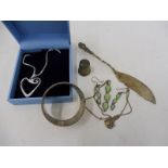 A small selection of silver including an ornate butter knife, Chester hallmark, a necklace and