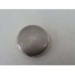 A small circular silver pill pot with good quality engine turned decoration.