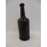 An early green glass wine bottle.