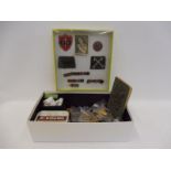 A box of mixed jewellery and a group of military ribbons, insignia etc.