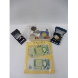 A cased 9ct gold ring set with cz and a selection of coinage.