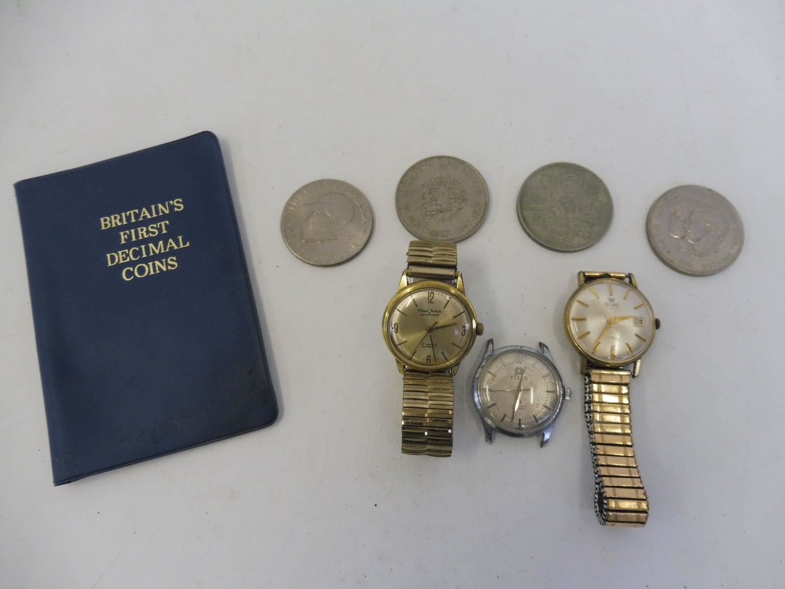 Three gentleman's wristwatches and a small quantity of coins including crowns.