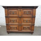 A 17th Century oak chest of two short and two long geometric moulded drawers on stile feet.