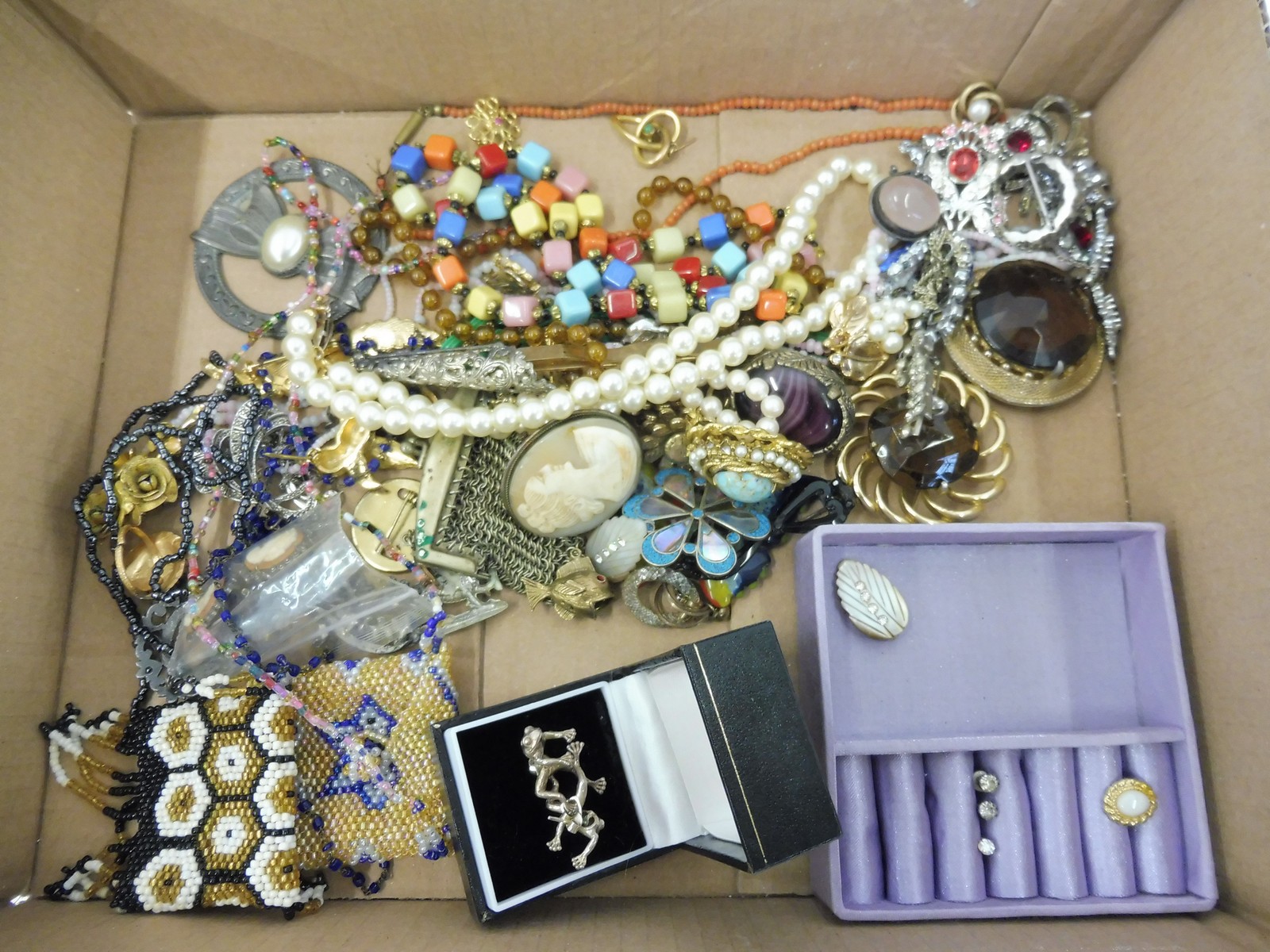 A tray of assorted jewellery including coral, beadwork purses etc.