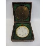 A gilt brass Negretti & Zambra of London aneroid barometer and a brass weather forecasting