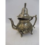 An unusual Oriental white metal teapot.