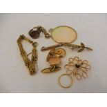 A small box of mostly 9ct gold including a delicate brooch in the form of a flower.