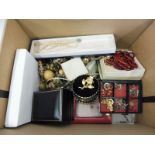 A box of assorted costume jewellery.