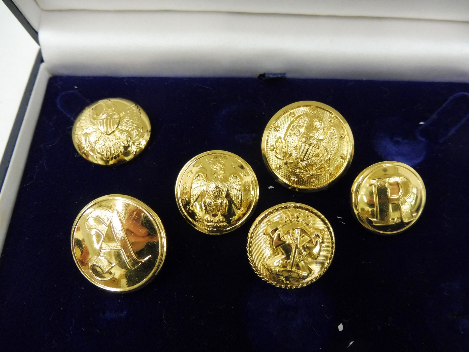 Six cased Firmin & Sons dress buttons.