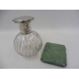 A silver mounted bulbous glass scent bottle and a shagreen covered silver cigarette case.