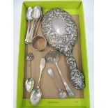 A set of six silver teaspoons, four further silver spoons including a sifter, a silver backed mirror