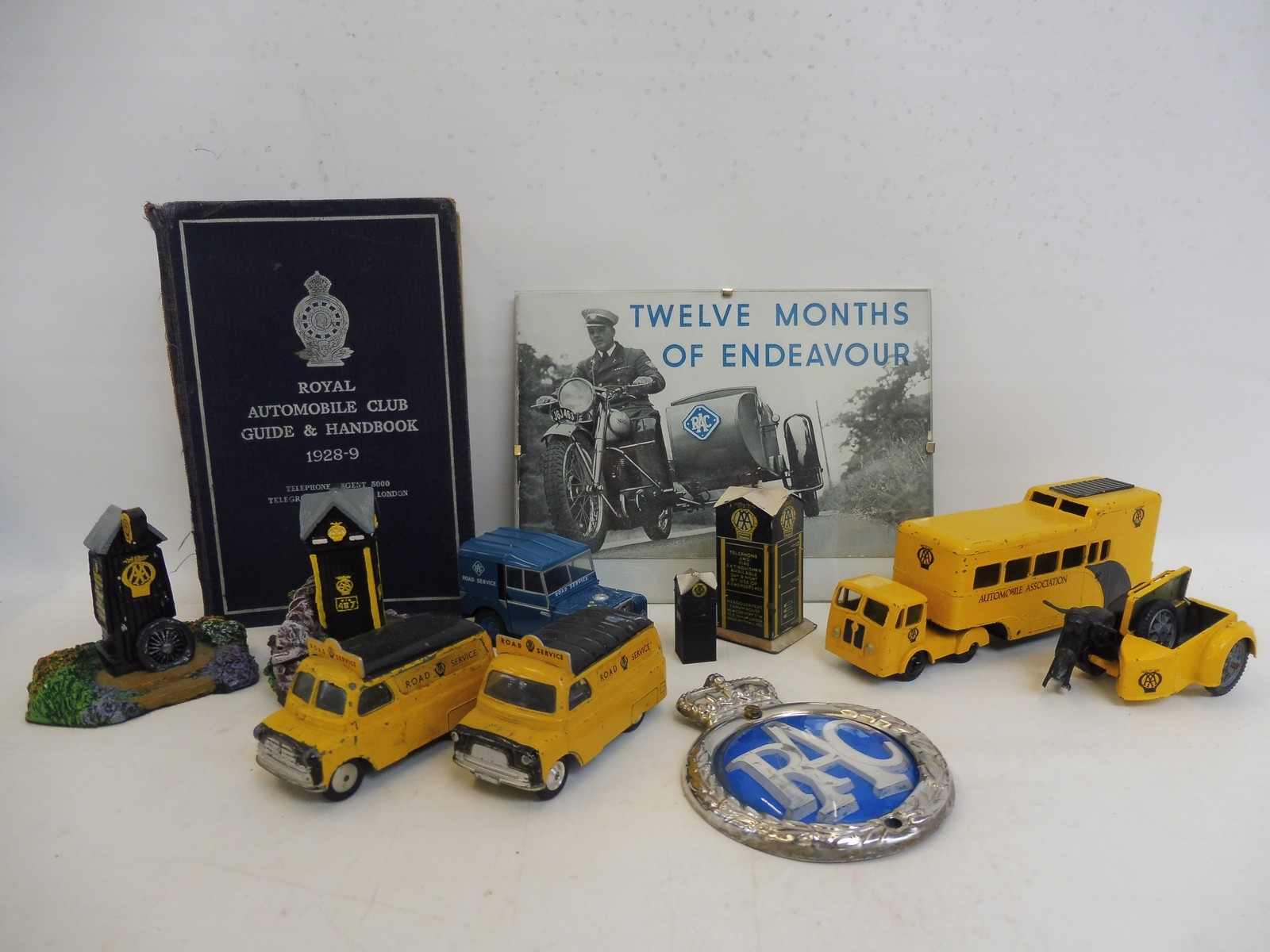 A tray of RAC and AA promotional models including an early AA tinplate box.