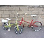 A Raleigh Small Rider child's bicycle and one other.