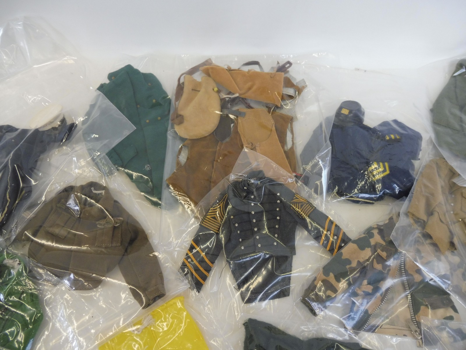 A box of Action Man uniforms generally in good condition to include Lifeguard and 7th Calvary etc. - Image 2 of 3