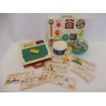 A collection of mostly 1970s Fisher Price including an Activity Centre and a School Days Desk