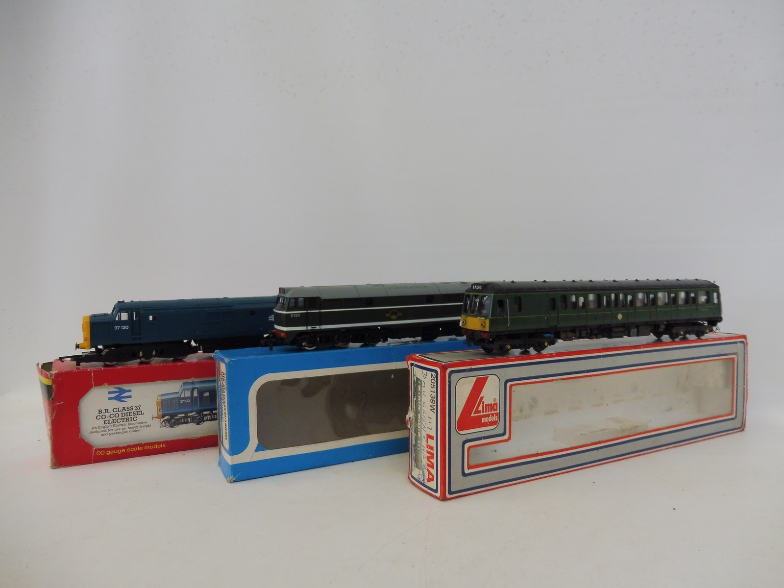 Three boxed diesel locomotives by Lima, Hornby and Airfix.