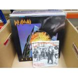 20 mainly Rock vinyl albums to include ACDC, Saxon, Def Leppard and others, generally VG+ and