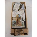 A collection of cigarette cards, mostly natural history related, animals and fish.