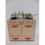 A French tinplate cooker marked Mignonette to the front, plus various utensils.