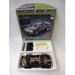 A boxed Mercedes-Benz 280CE radio controlled car.