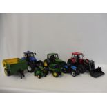 A selection of large scale Britains and Bruda plastic farm machinery.