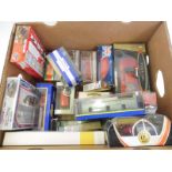 A quantity of boxed model cars.