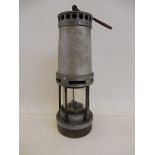 An aluminium miners lamp.