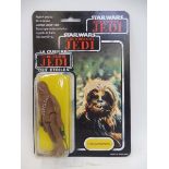 A Star Wars tri-logo Chewbacca carded figure, cracking to bottom of window box left and right, 79