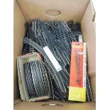 A box of oo gauge railway track etc.