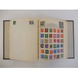 A stamp album containing various issue stamps including pre-WWII German images.