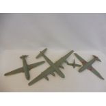 A group of four wooden models of aircraft, used as teaching aids, one marked Super Fortress.