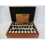 A cased limited edition presentation set of 52 silver coins and military badges by the Birmingham