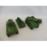 Four early Dinky military vehicles to include tanks and gun carriers, repainted to a high standard.