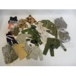 A tray of Action Man accessories including camouflage uniforms etc.