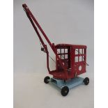 A Tri-ang tinplate crane, in good condition.