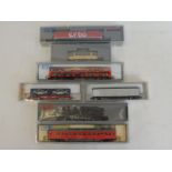 A selection of boxed Kato N gauge model railway including a car transporter.