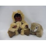 An unusual early rubber or similar doll dressed as an inuit, plus a Steiff rabbit.
