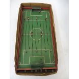 An early wooden football game with metal figures.
