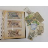 An album of bank notes, various currencies.