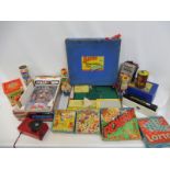 A collection of games including Bayko Converting sets, a Tomy Atomic Arcade Pinball game, Fisher