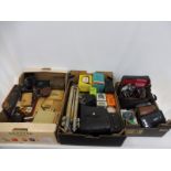 Three boxes of collectables including cameras, camera accessories, early buttons, a leather