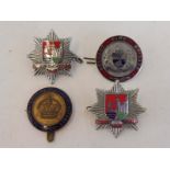 Two Bristol Fire Brigade part enamel badges, a Belfast Fire Brigade part enamel badge and a fourth