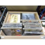 A box of CDs including REM, Guns and Roses, many genres (unchecked).