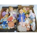 Two boxes of assorted dolls, accessories and clothing.