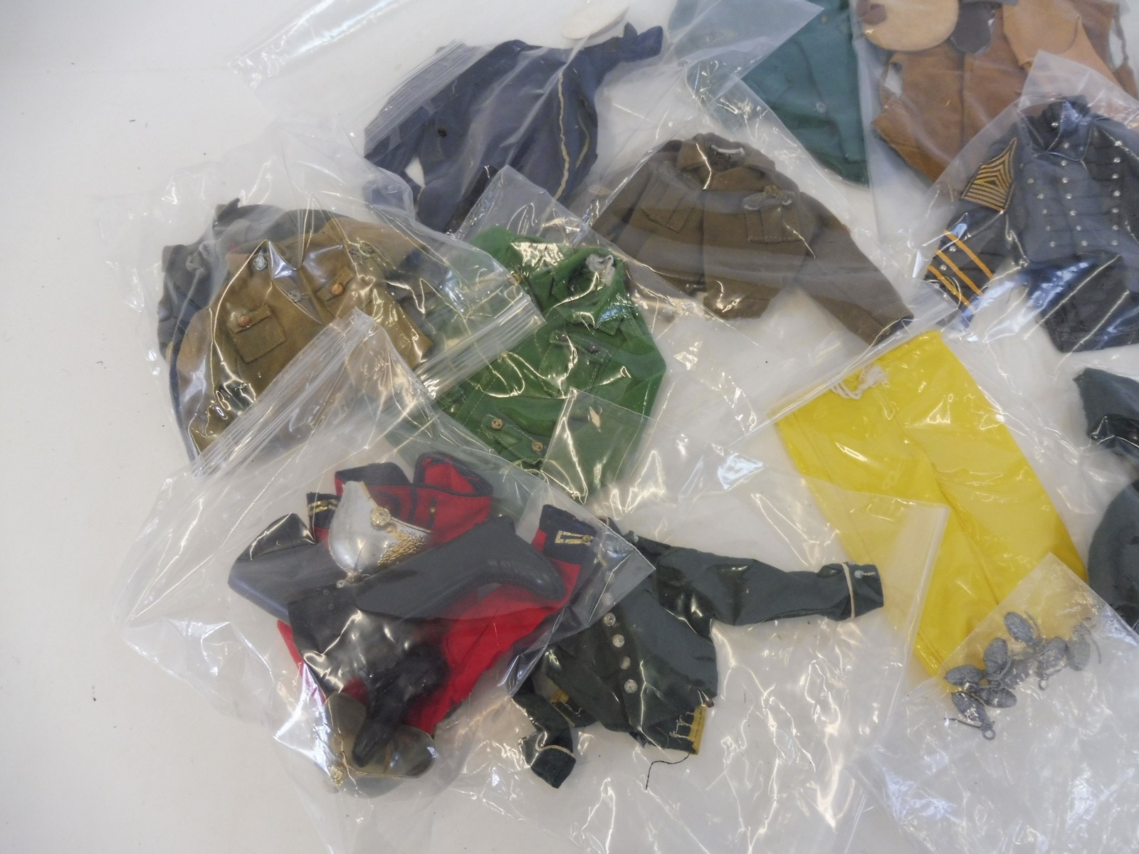 A box of Action Man uniforms generally in good condition to include Lifeguard and 7th Calvary etc. - Image 3 of 3