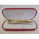 A cased Sheaffer pen set.