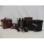 A cased Sedic Super 8 cine camera, a cased Halina 35X camera and two pairs of binoculars.
